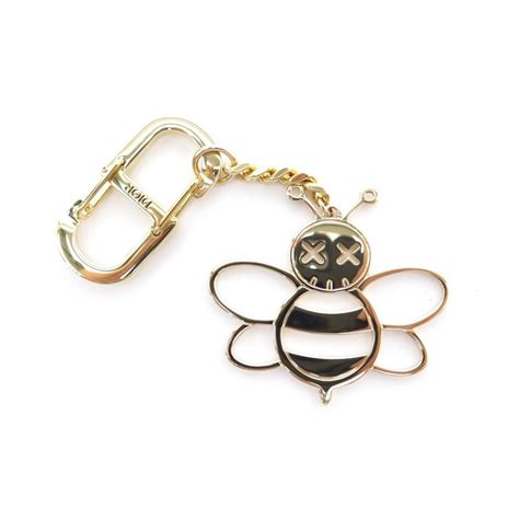 porte cle dior|porte cle christian dior x kaws bee en metal dore.